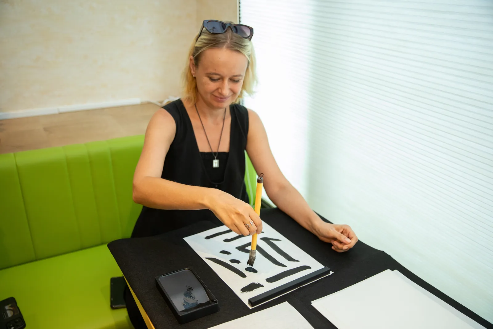 A participant practicing lines in black ink